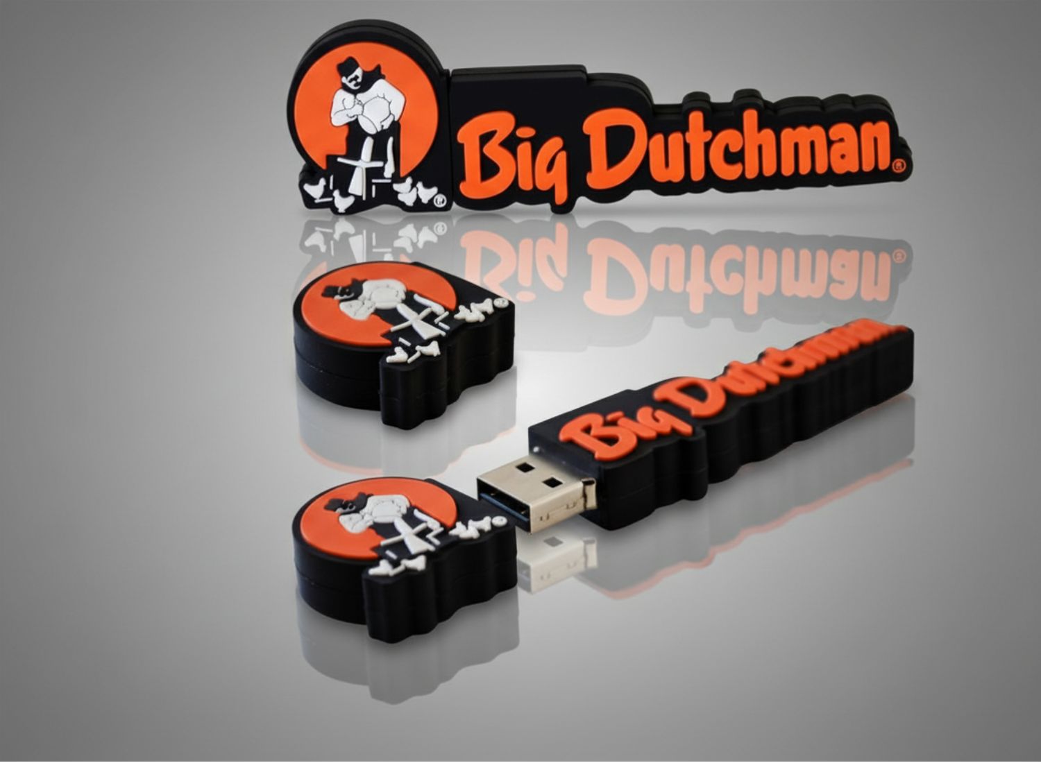 Pamięci USB w dedykowanym kształcie 3D wykonane z PVC w formie logo Big Dutchman. Unikalne gadżety reklamowe na zamówienie.