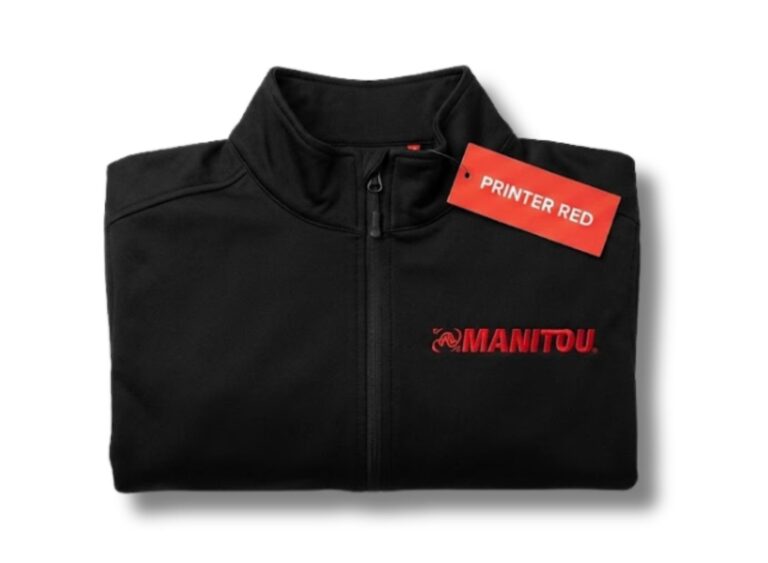 Czarny softshell reklamowy z czerwonym znakowaniem logo Manitou. Wytrzymała odzież biznesowa dla producentów i przemysłu.